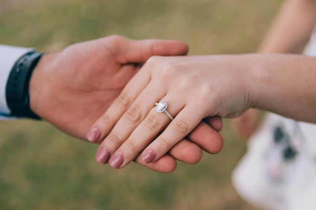 Lady's hand displaying a diamond engagement ring by Mark Nathan Jewellery