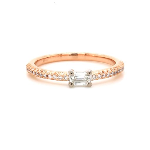Engagement ring called 'Nikki' by Mark Nathan Jewellery. Rose gold band with centre emerald cut diamond. 12 smaller round diamonds on either side of the centre diamond.